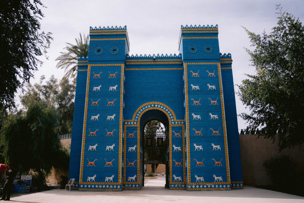 Bright blue replica of the Ishtar Gate at Babylon, Iraq, adorned with golden lions, bulls, and dragons—recreating the grandeur of the ancient Mesopotamian city.