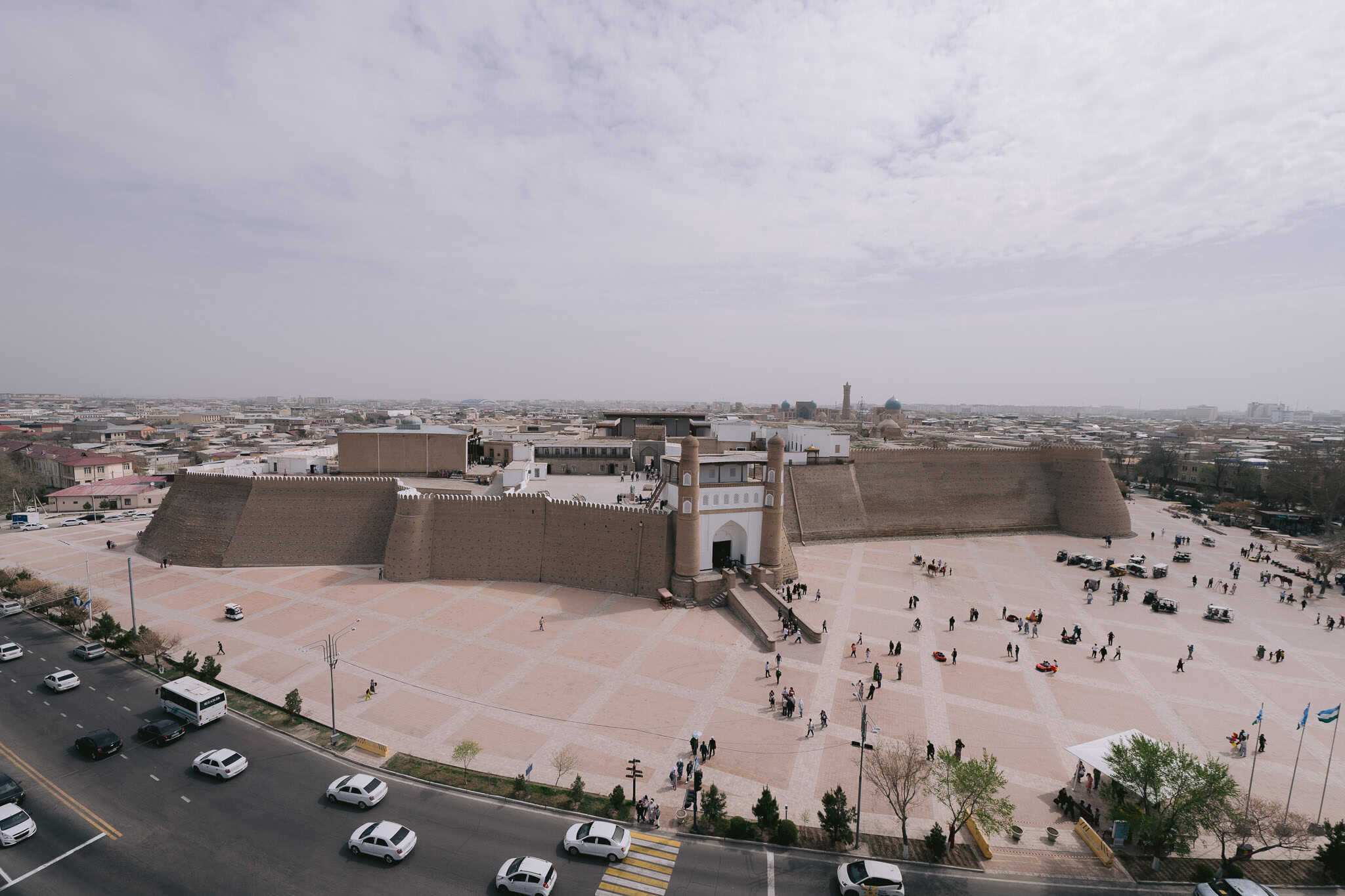 Aerial view of Ark Fortress in Bukhara, Uzbekistan with city skyline.