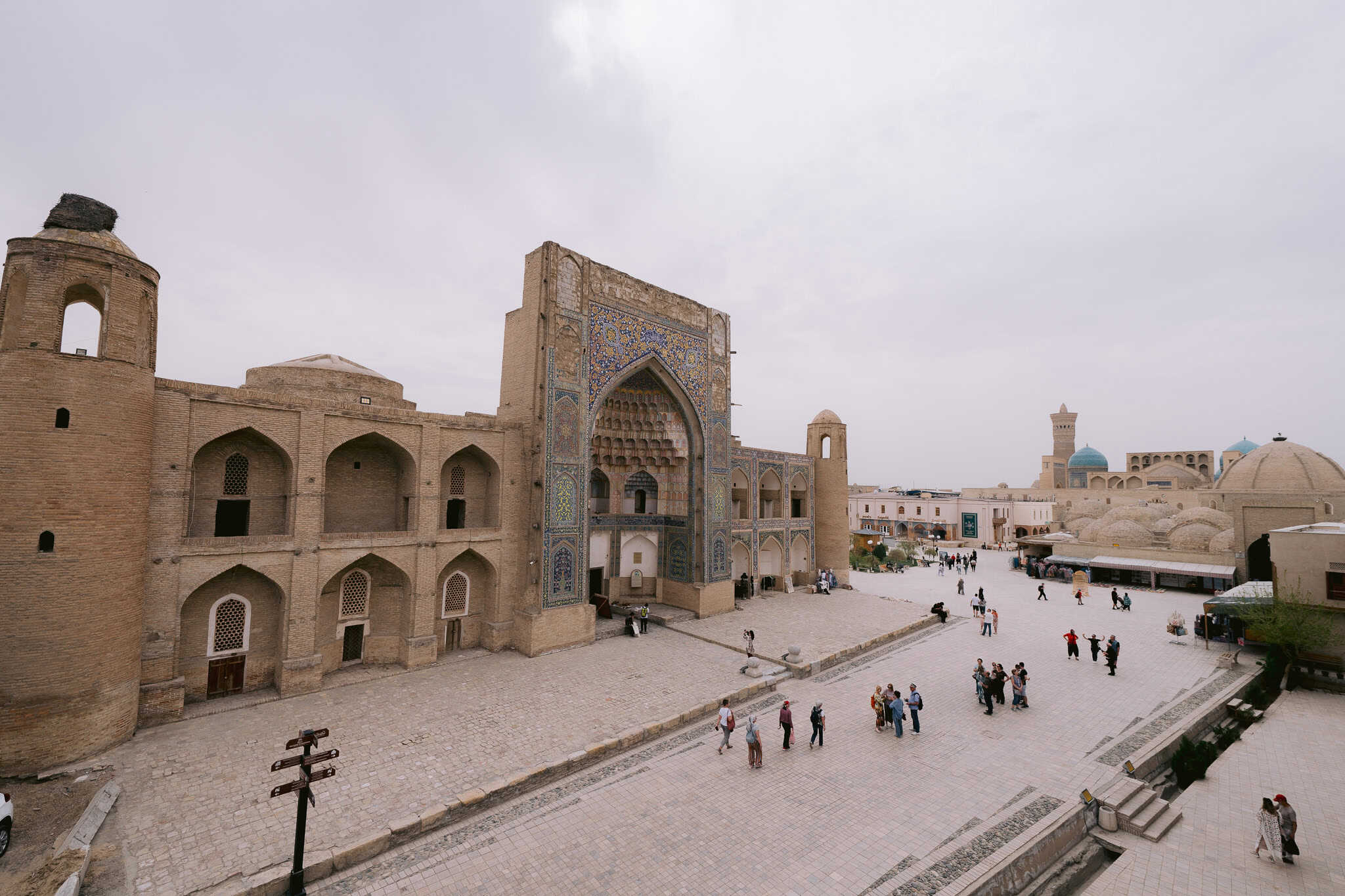 Bukhara Silk Road square with madrassas, domes, and minarets in Uzbekistan.