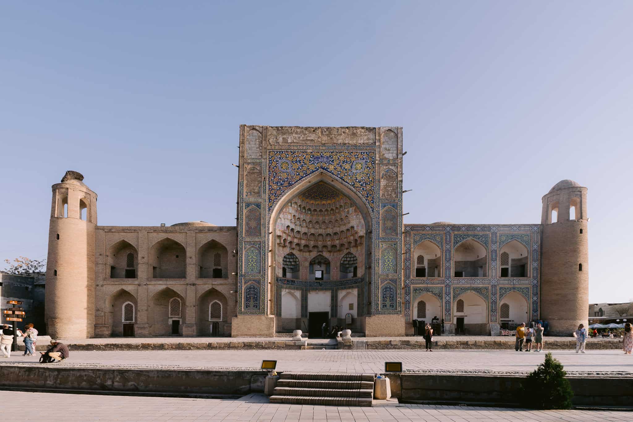 Mosaic-covered facade of Nadir Divan-Begi Madrassa in Bukhara, Uzbekistan.