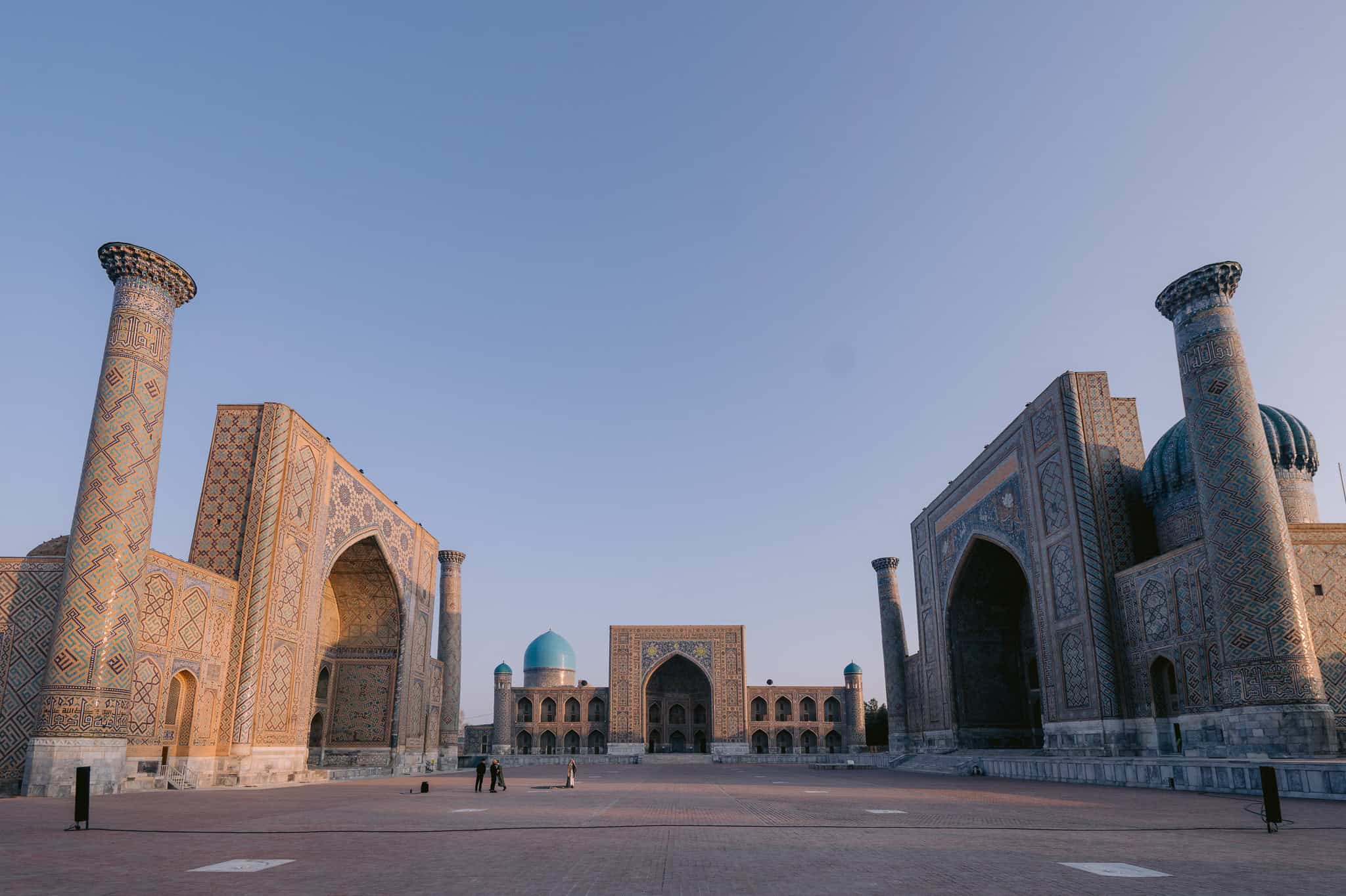 Registan Square in Samarkand, Uzbekistan with intricate mosaics and madrassas at sunrise – a highlight when asking is Uzbekistan worth visiting.