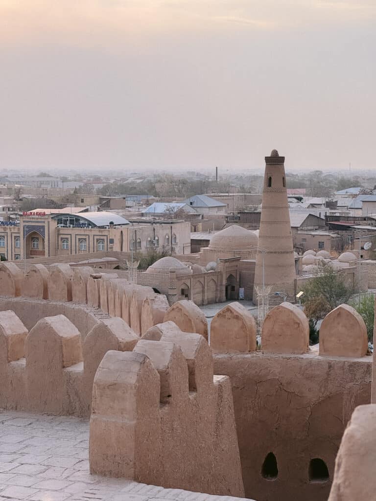 Peaceful panoramic view of Khiva old town at sunset, reflecting the calm and safe travel atmosphere in Uzbekistan.
