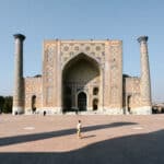 Woman standing alone in front of the Registan in Samarkand, showing that Uzbekistan’s most famous landmarks feel safe for women to explore.