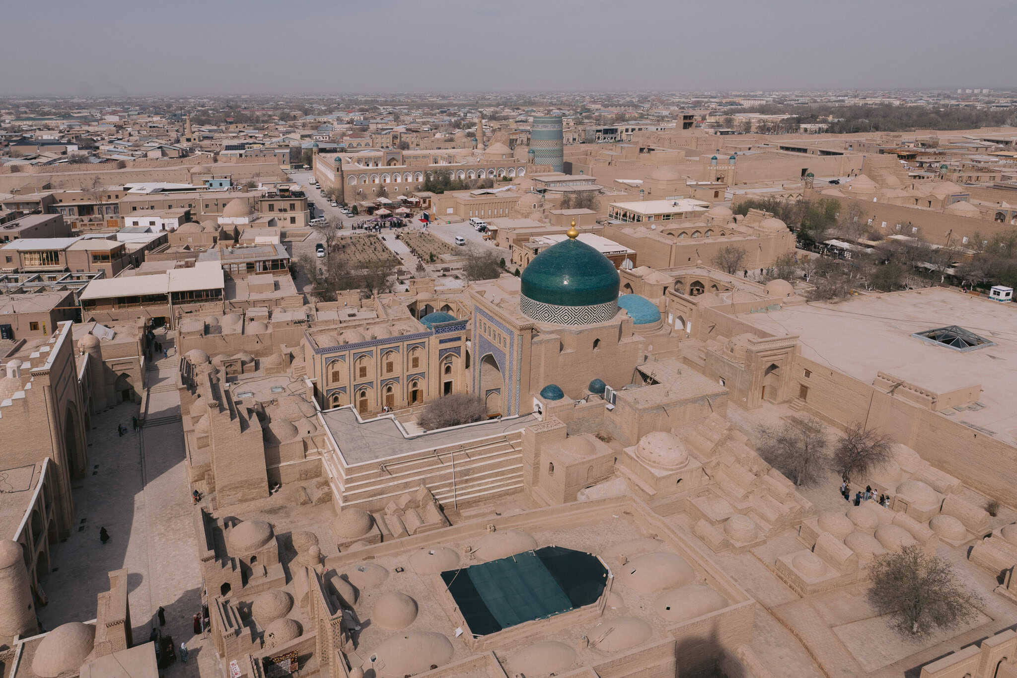 Aerial view over Khiva’s walled city Itchan Kala with turquoise domes and minarets — a must-see highlight in Uzbekistan.
