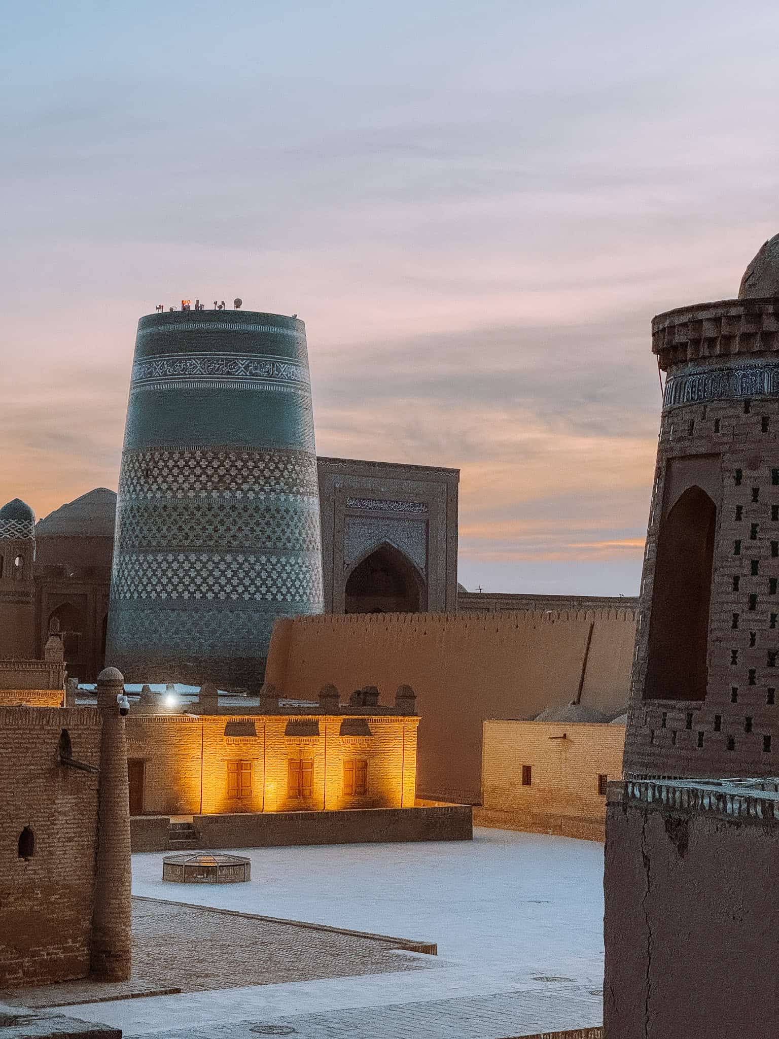 Kalta Minor Minaret in Khiva glowing at sunset — iconic skyline of Uzbekistan’s Silk Road city