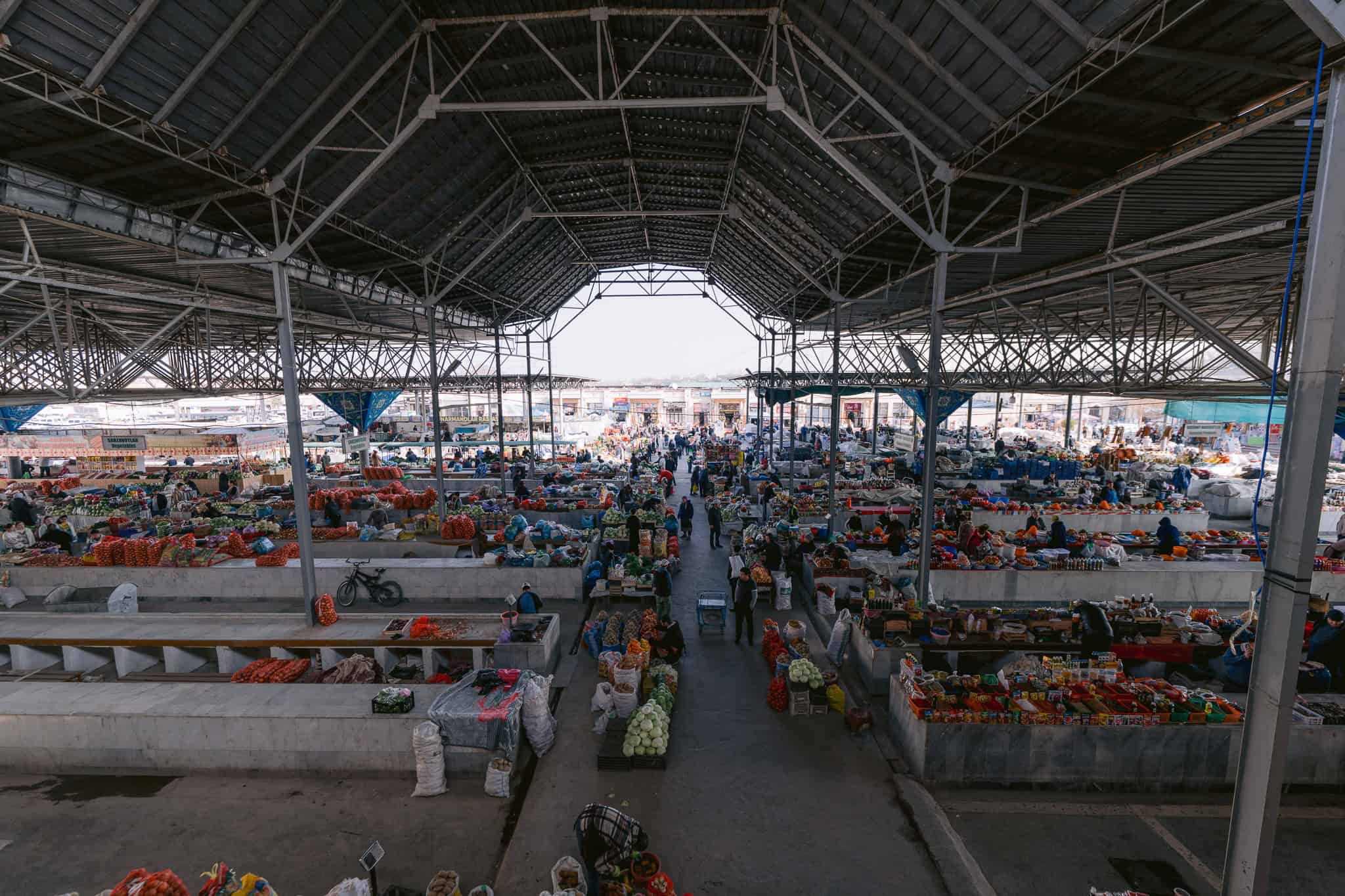 Siab Bazaar in Samarkand with vendors selling fruits, vegetables, and spices — traditional Uzbek market scene